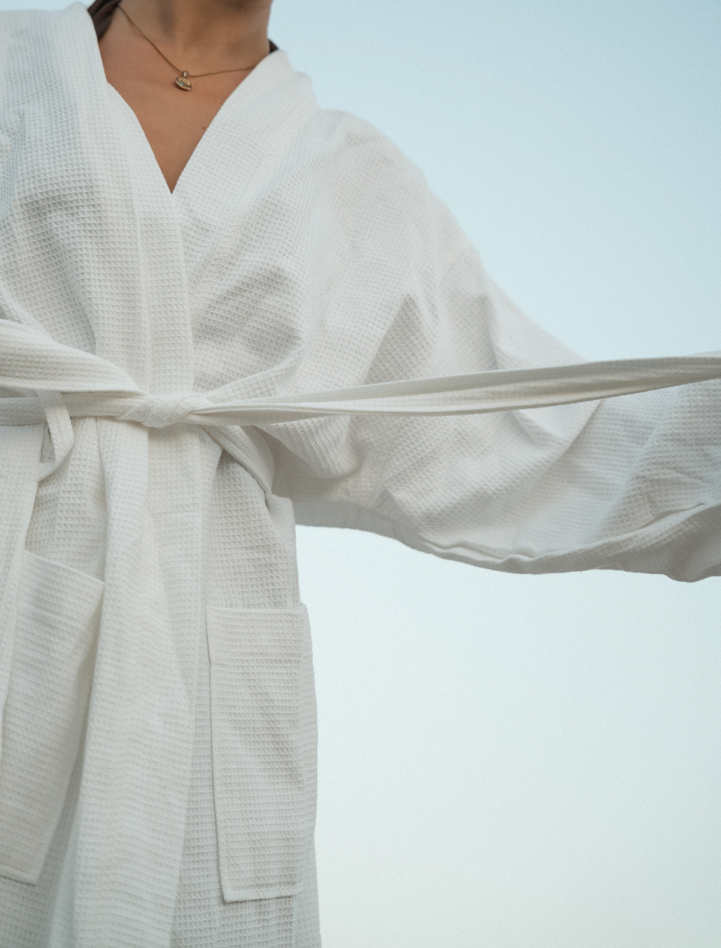 Waffle-weave Dover robe with belt tied at the waist