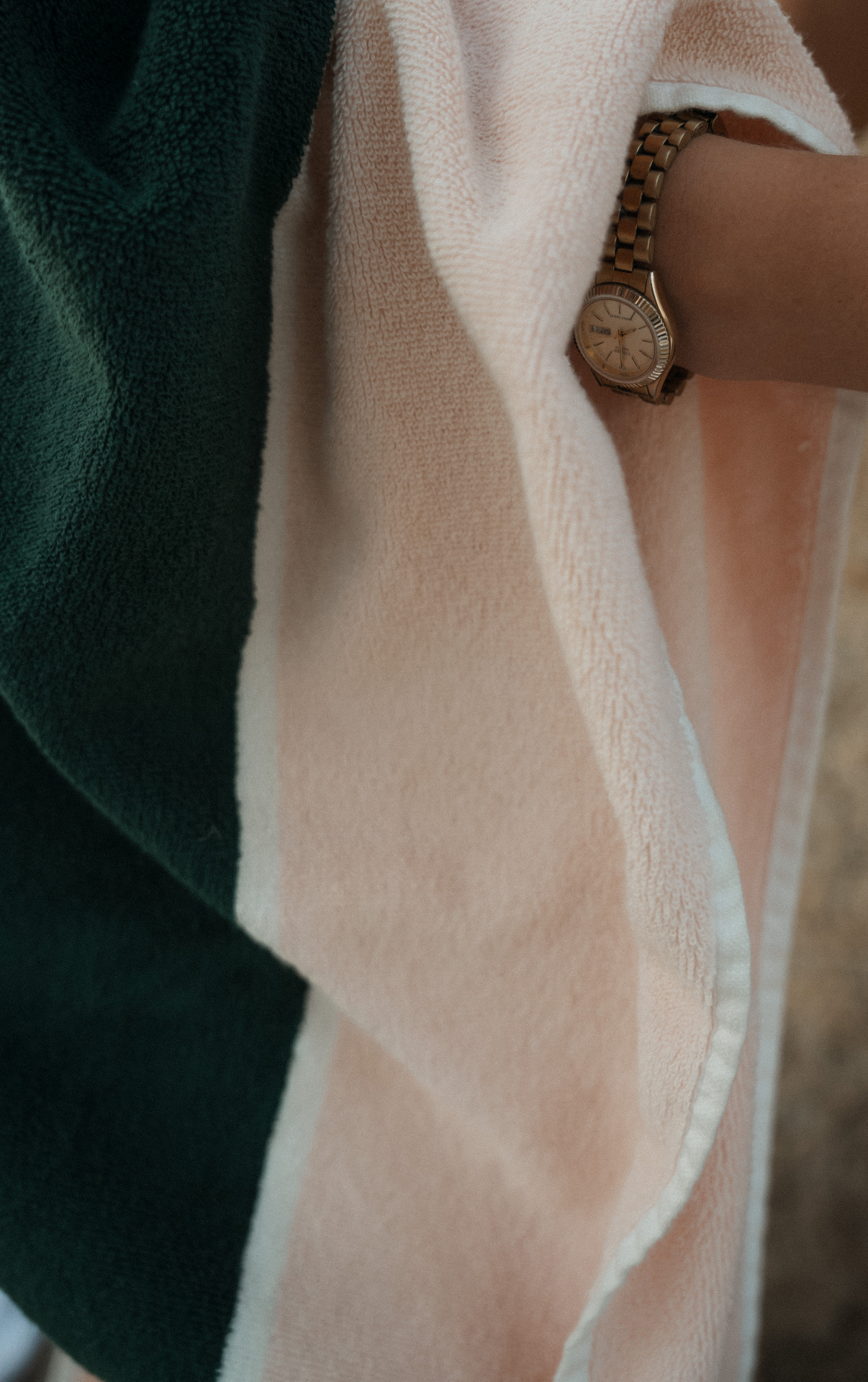 Close-up of the pink and green striped Dover pool towel