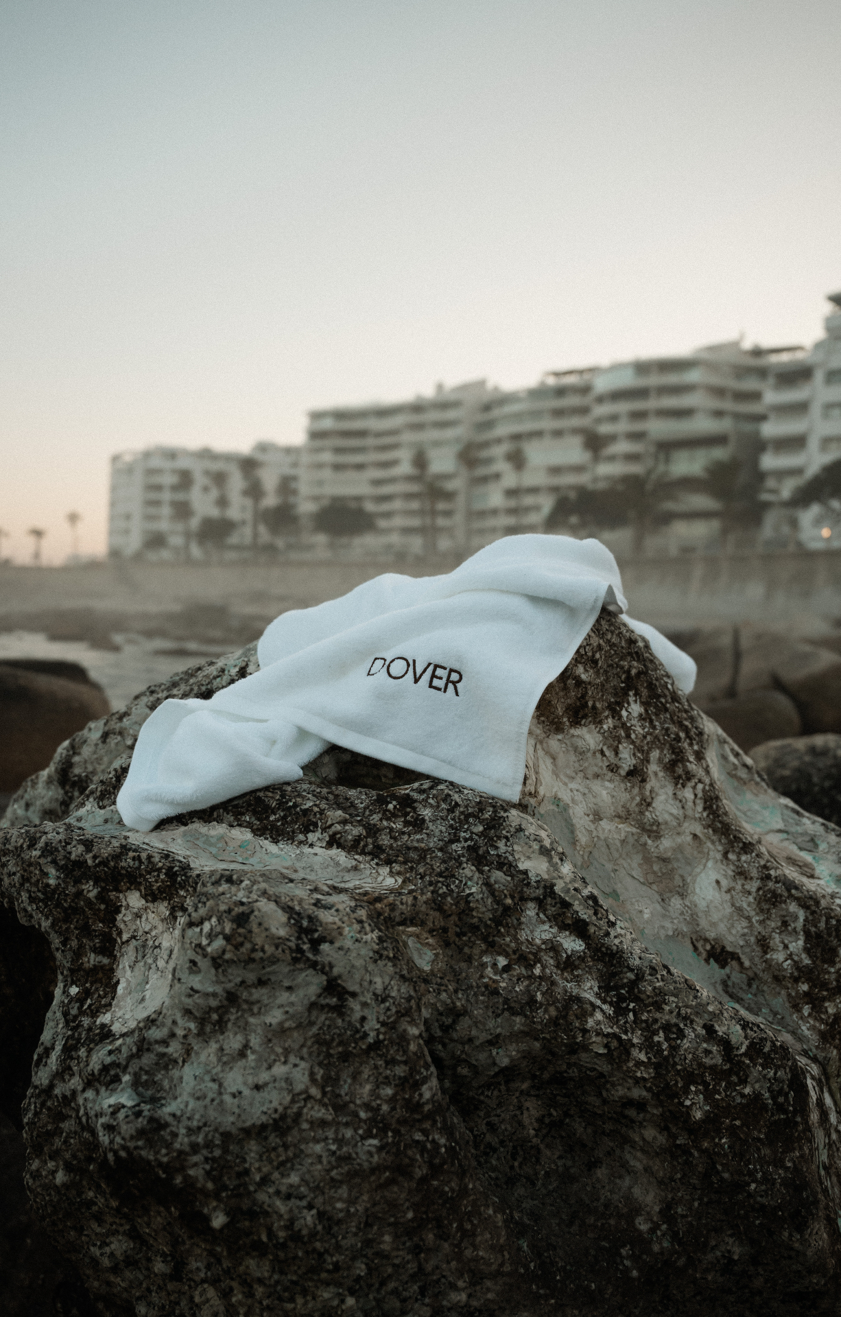 Dover towel draped over a coastal rock